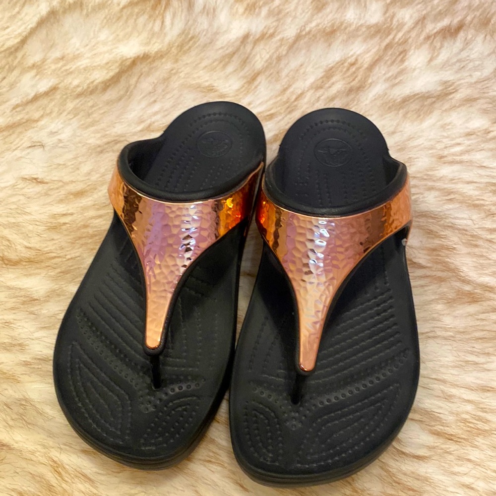 Almost new Crocs in black and copper color size 10